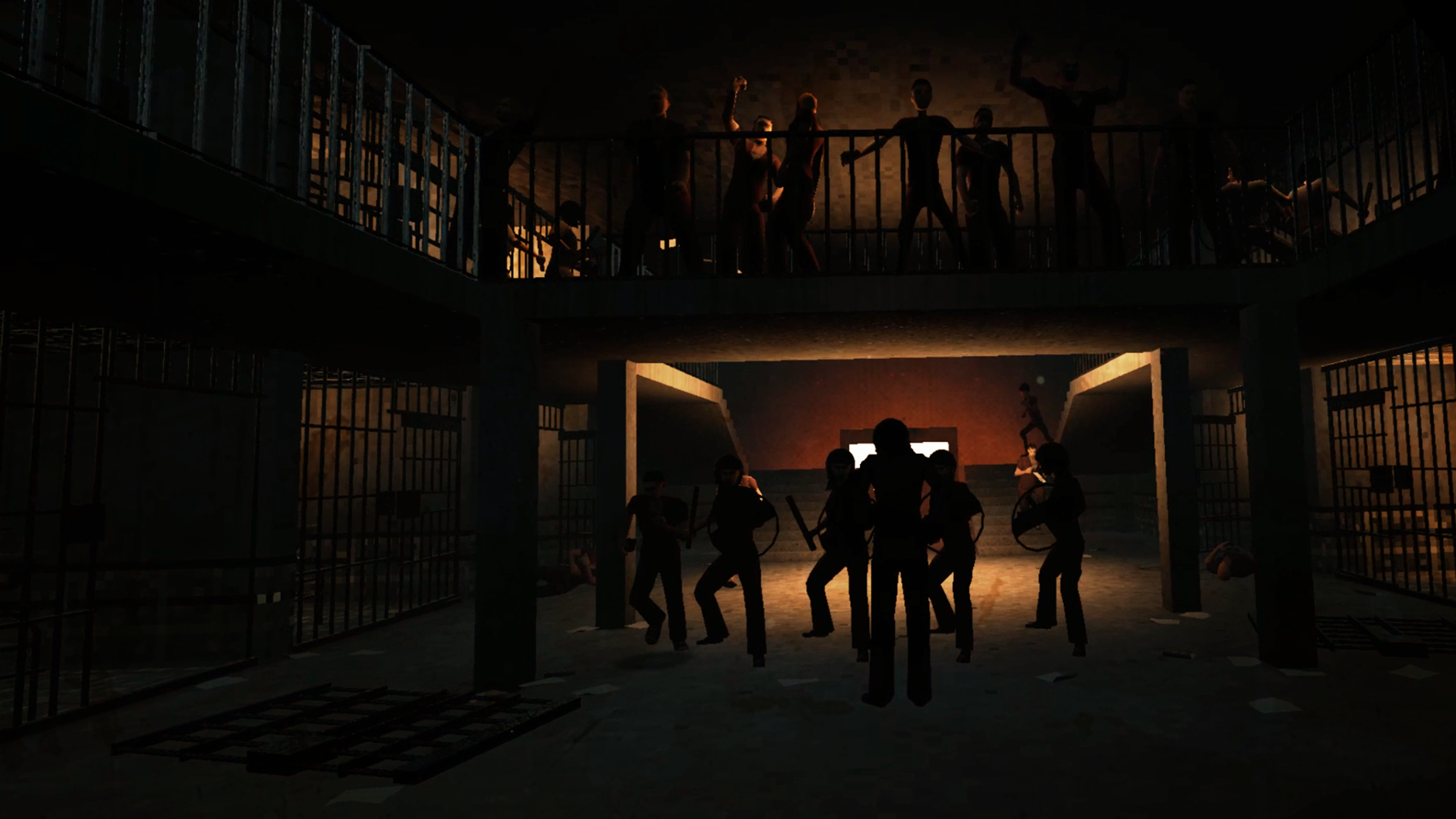 A dark room where groups of people obscured by shadow can be seen