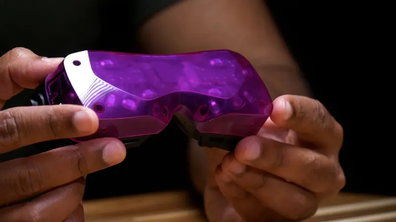 Small purple VR headset being held in someone's hands