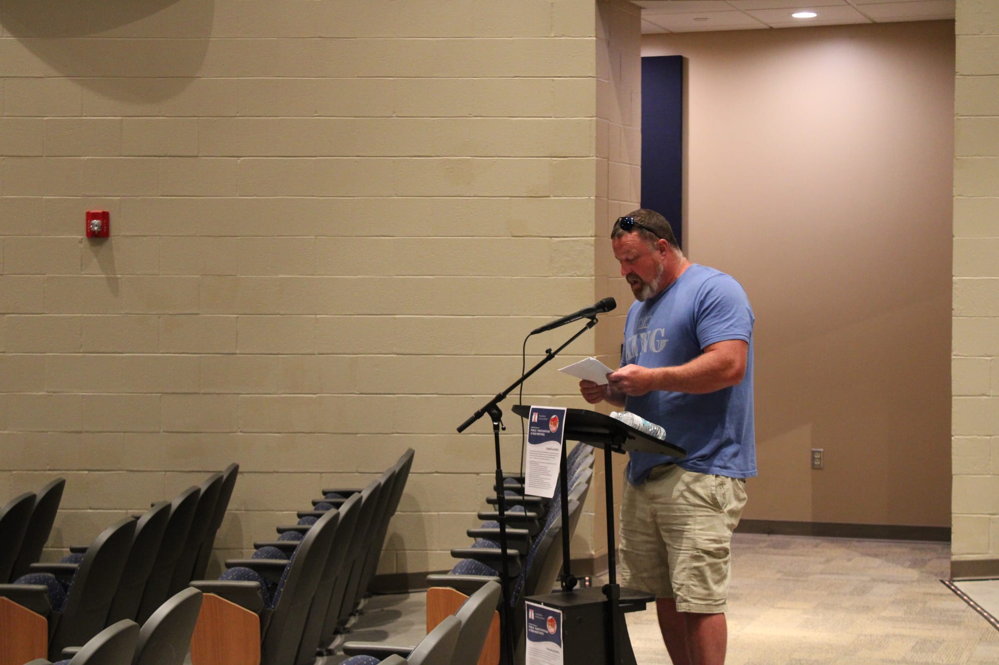 Scotty King speaks at a microphone in the Talawanda auditorium