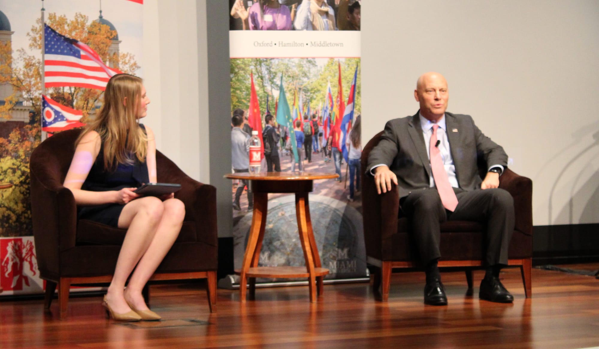 Marc Short sits to the right of an event moderator on stage