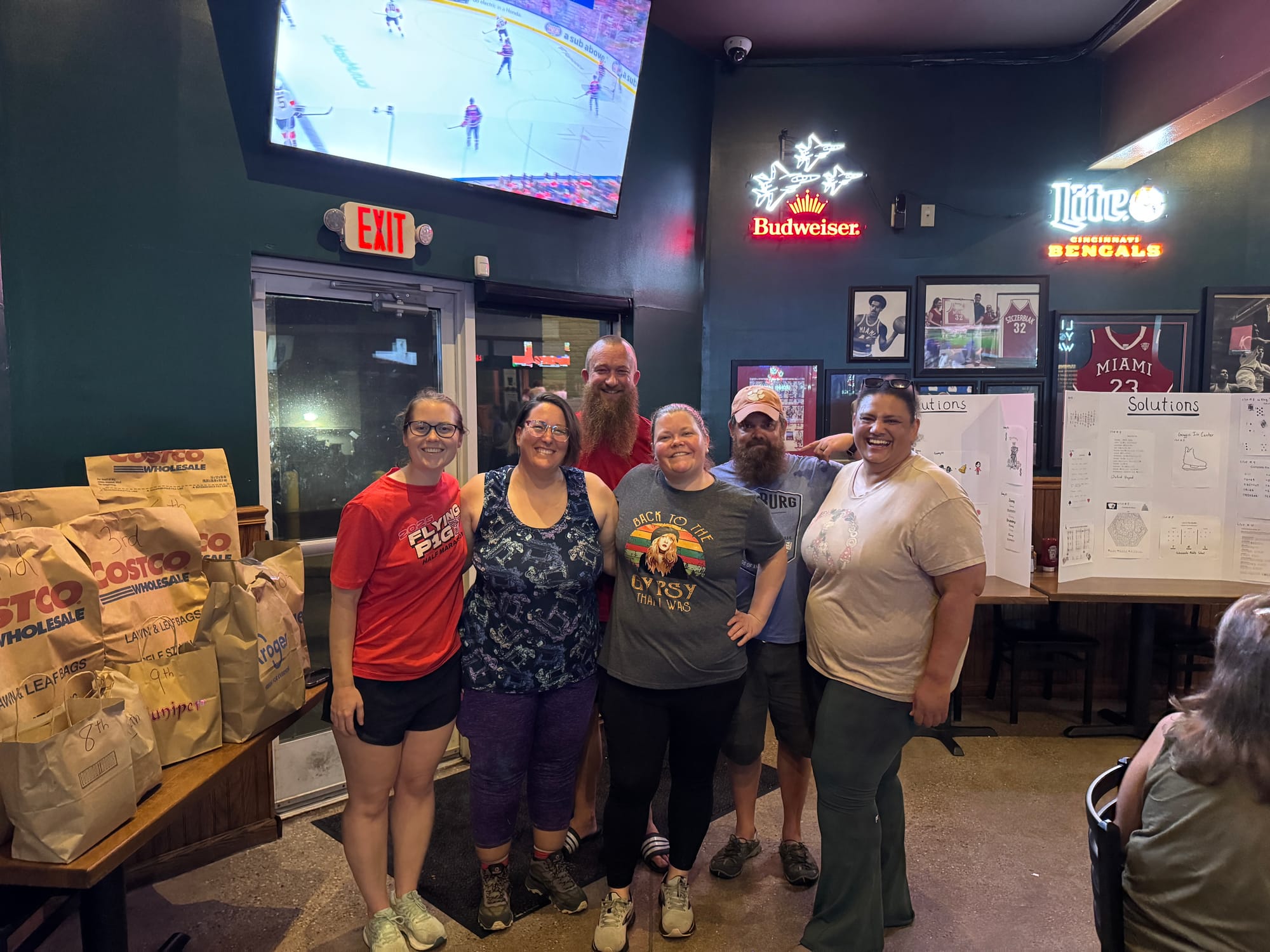 (Front left to right) Emily Cluen, Megan Kuykendoll, Barbara Bunting, (back left to right) Tim Kuykendoll, Jared Bunting and Tricia Hillman celebrate at Left Field Tavern