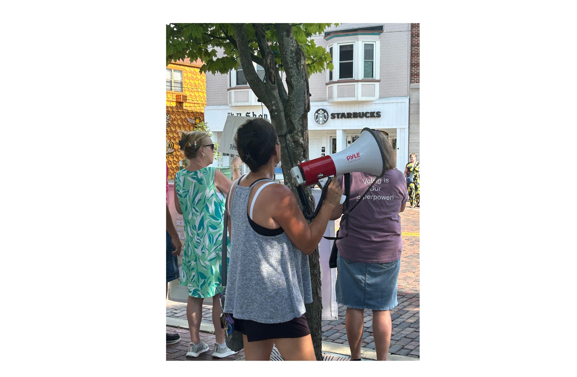 Nila Leslie, the chant leader for the event, helps dictate the protest’s chants south of Oxford Memorial Park