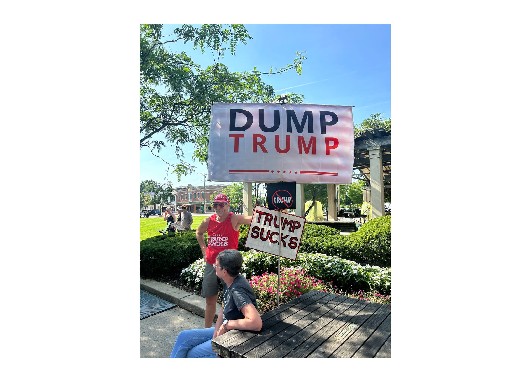 Jay Stevison holds up his protest signs at the “Good Trouble Lives On” protest in Oxford.