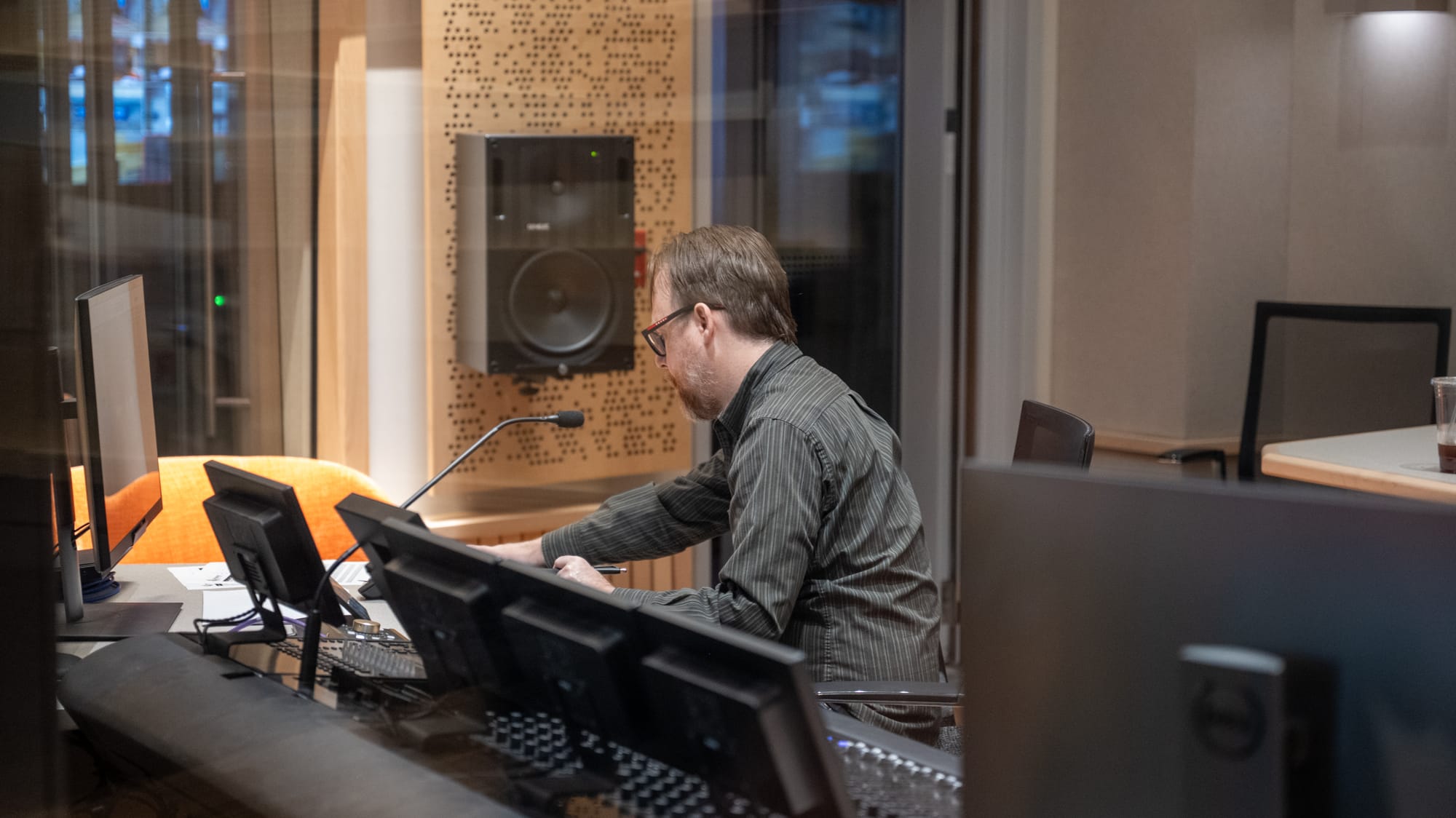An audio engineer at work at Cincinnati Public Radio