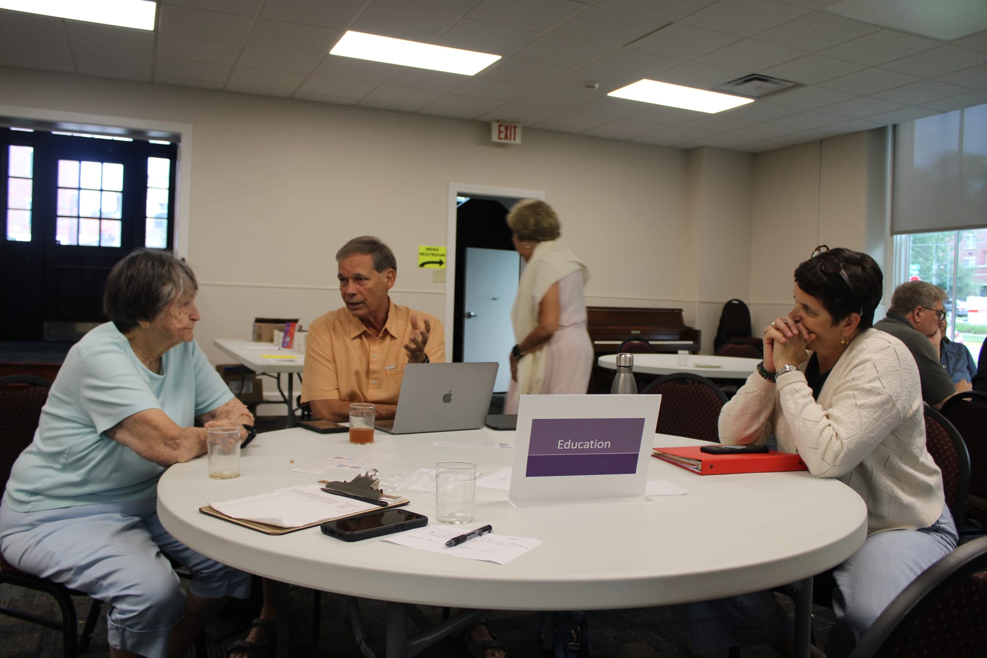 At the end of the OASH meeting on July 28, groups met at individual tables to discuss their work and progress on various programs offered by the organization.