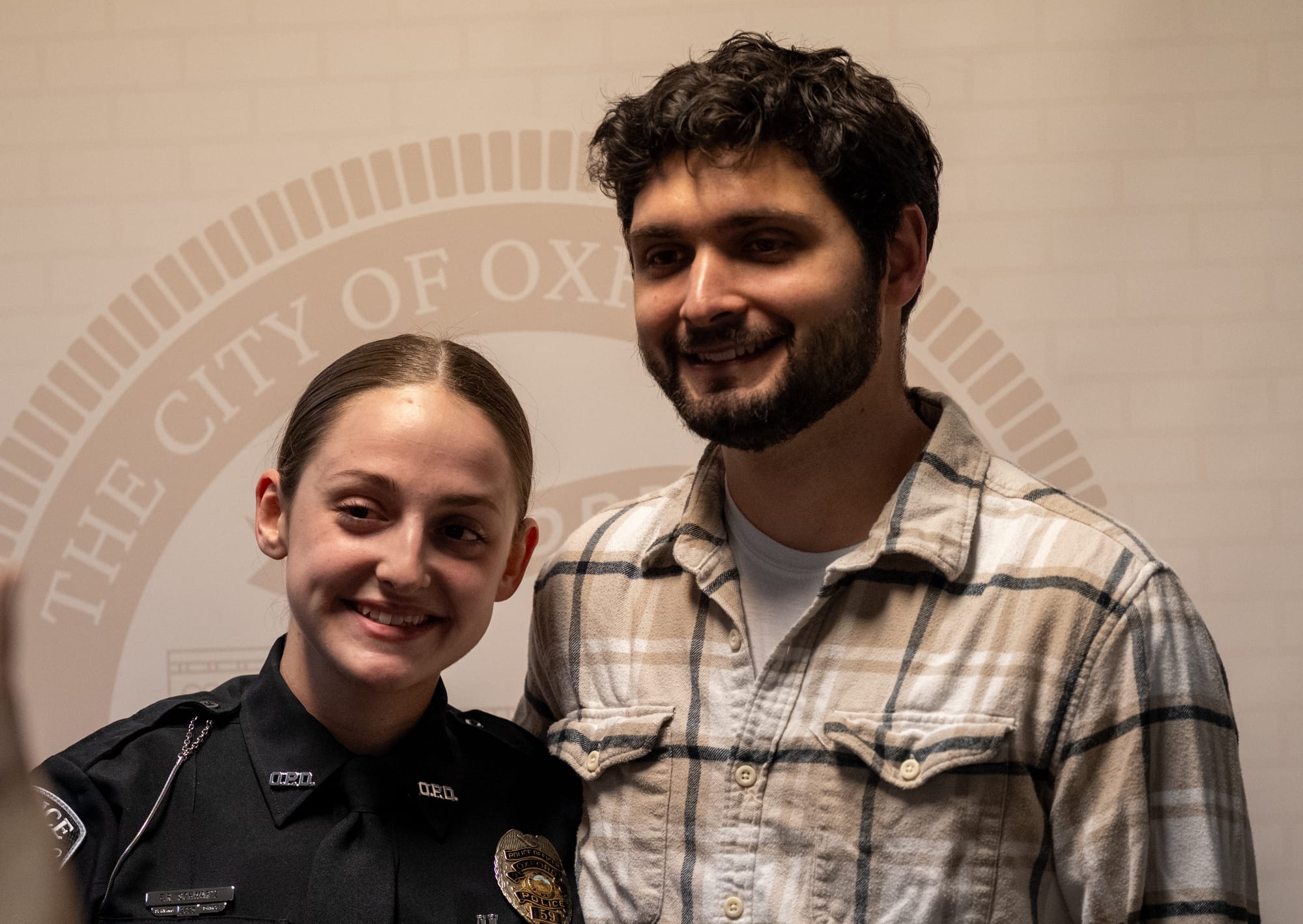 Elana Schwartz (left) and her husband (right) smile for a photo