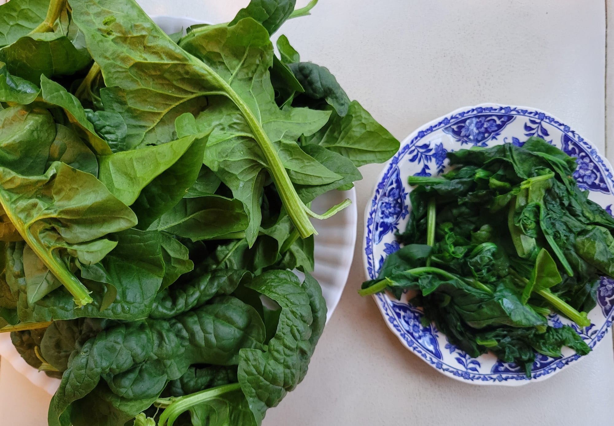 The same amount of local spinach before and after cooking.