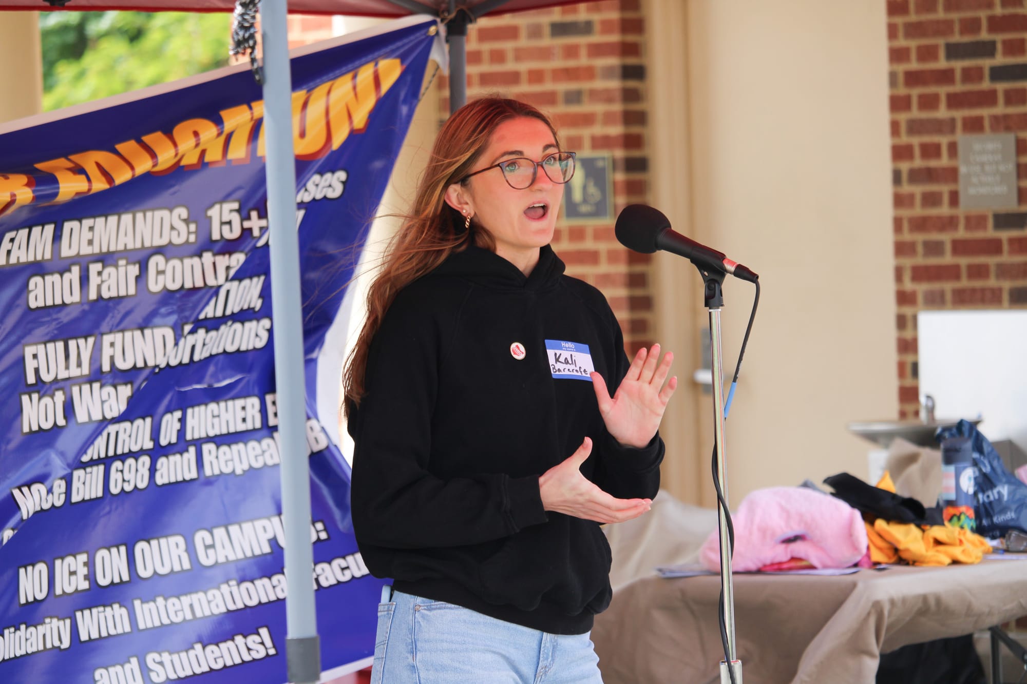 Kali Barcroft, president of the Miami University chapter of the Ohio Student Association speaks during a protest