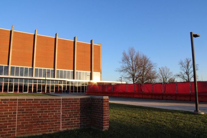 Millett Hall seen from the west behind a red construction fence