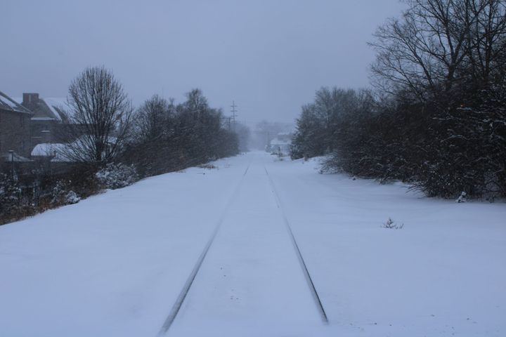 Train tracks covered in snow
