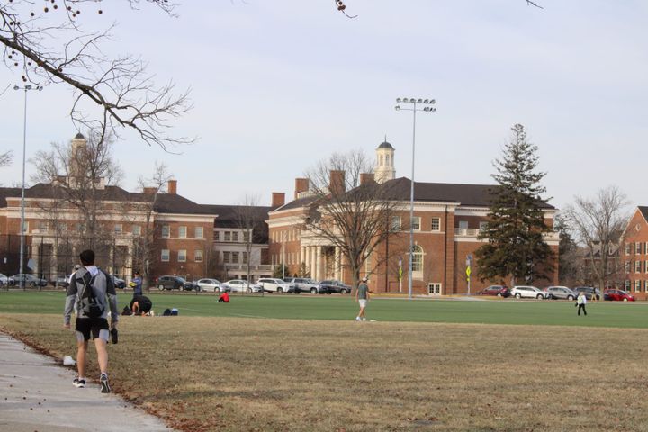 People walk on Cook Field at Miami University