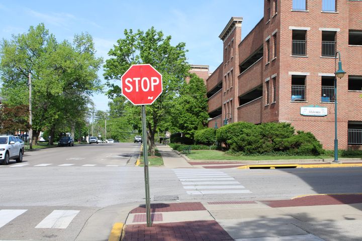 A stop sign at a Walnut Street intersection
