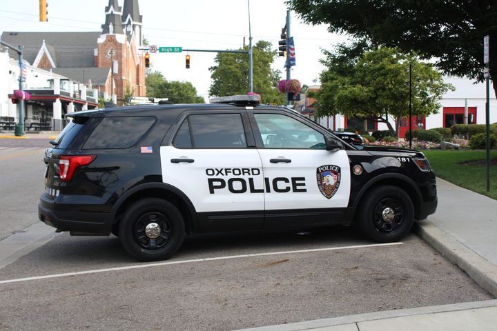 An Oxford Police Department car sits parked on High Street.