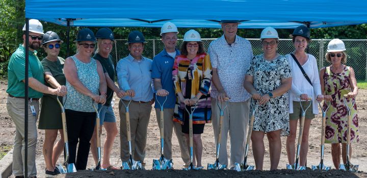 TOPSS Members pose for pictures after “breaking ground.”