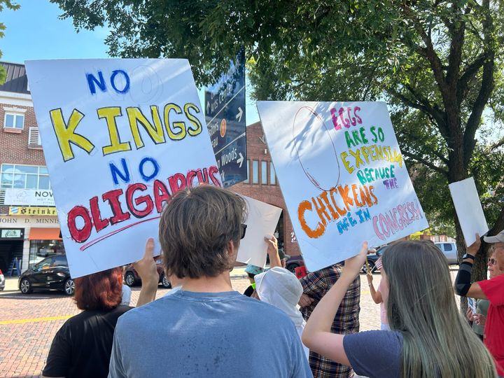 Protesters carry signs and participate in chants at the “Good Trouble Lives On” protest.
