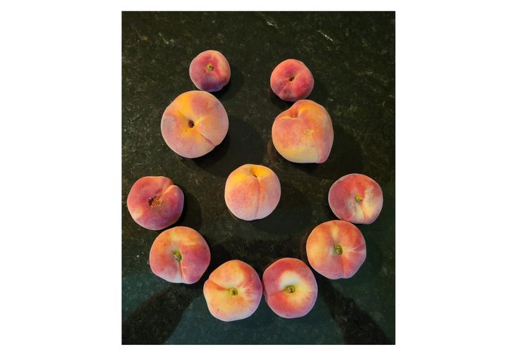 Local Oxford peaches arranged to look like a smile.
