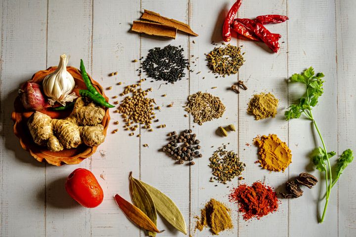 A variety of spices on a white table