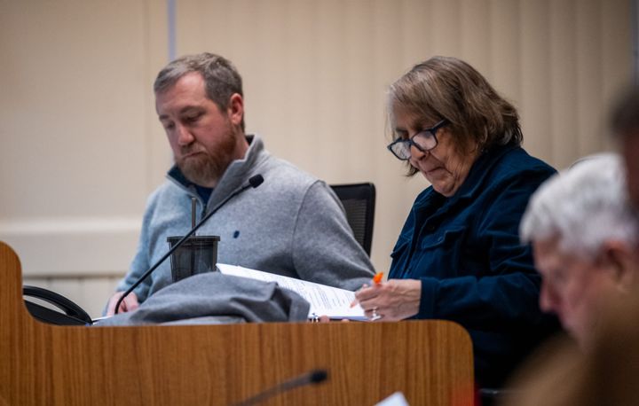 Oxford City Councilors Jason Bracken, left, and Roxanne Ornelas listen to a brief presentation of a resolution during an Oxford City Council meeting