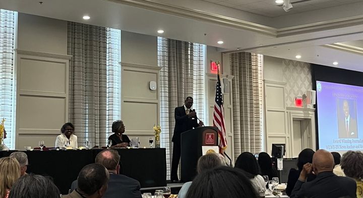 Courtis Fuller (right) speaks at the Oxford NAACP’s 2025 Freedom Fund Banquet. NAACP President Fran Jackson (left) and Vice President Vanessa Cummings (middle) sit beside him. 