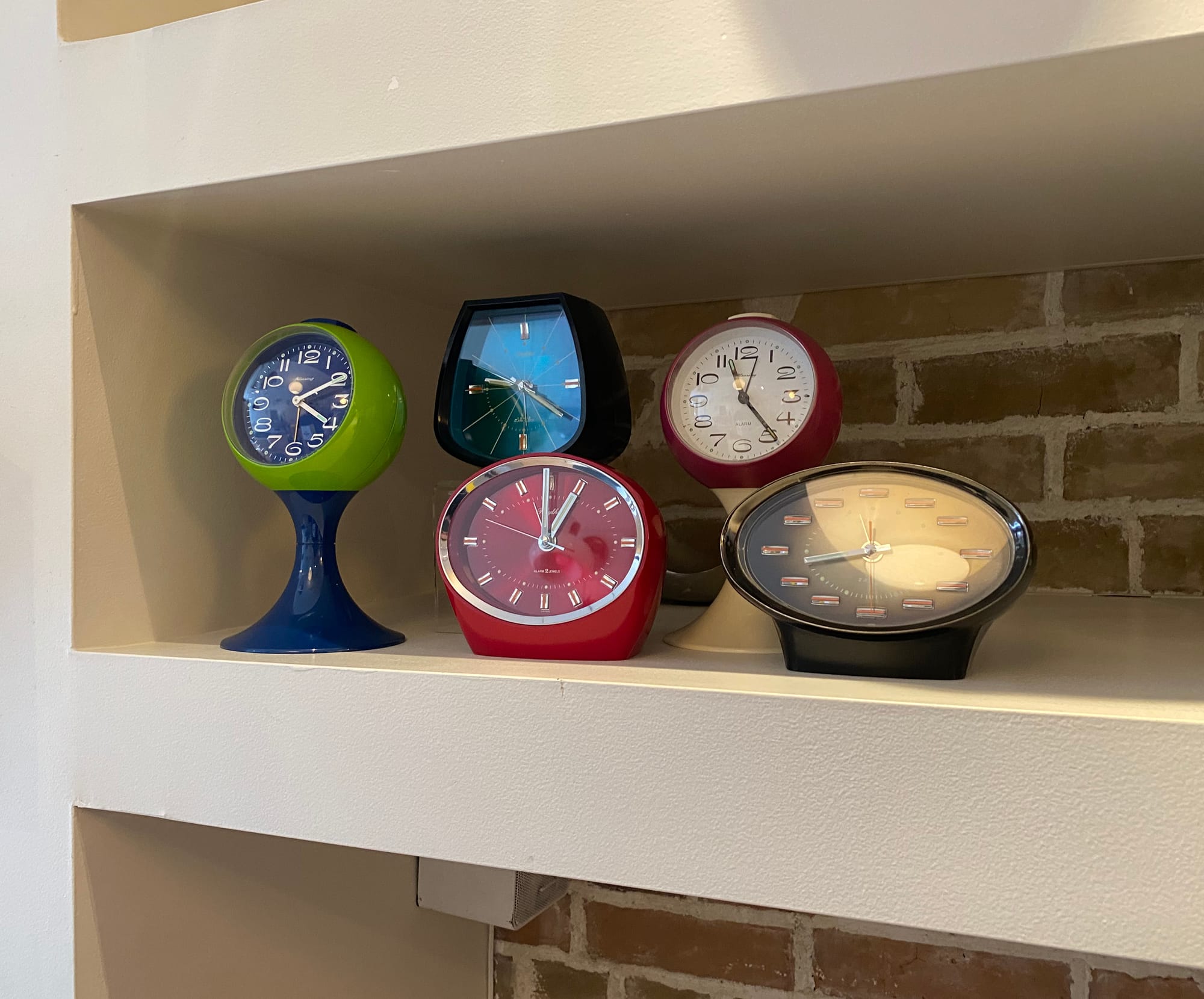 Eclectic grouping of five vintage clocks.