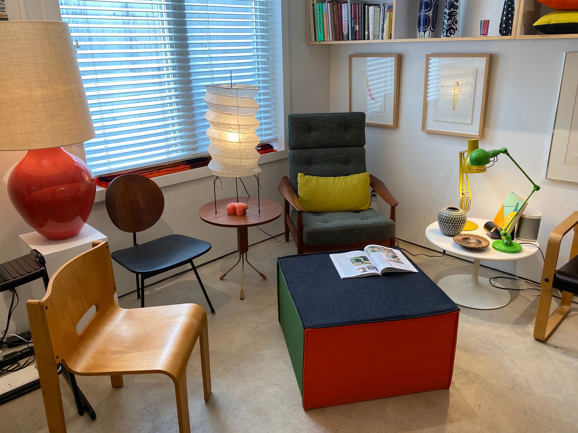 An arrangement of modern chairs, lamps and side tables.