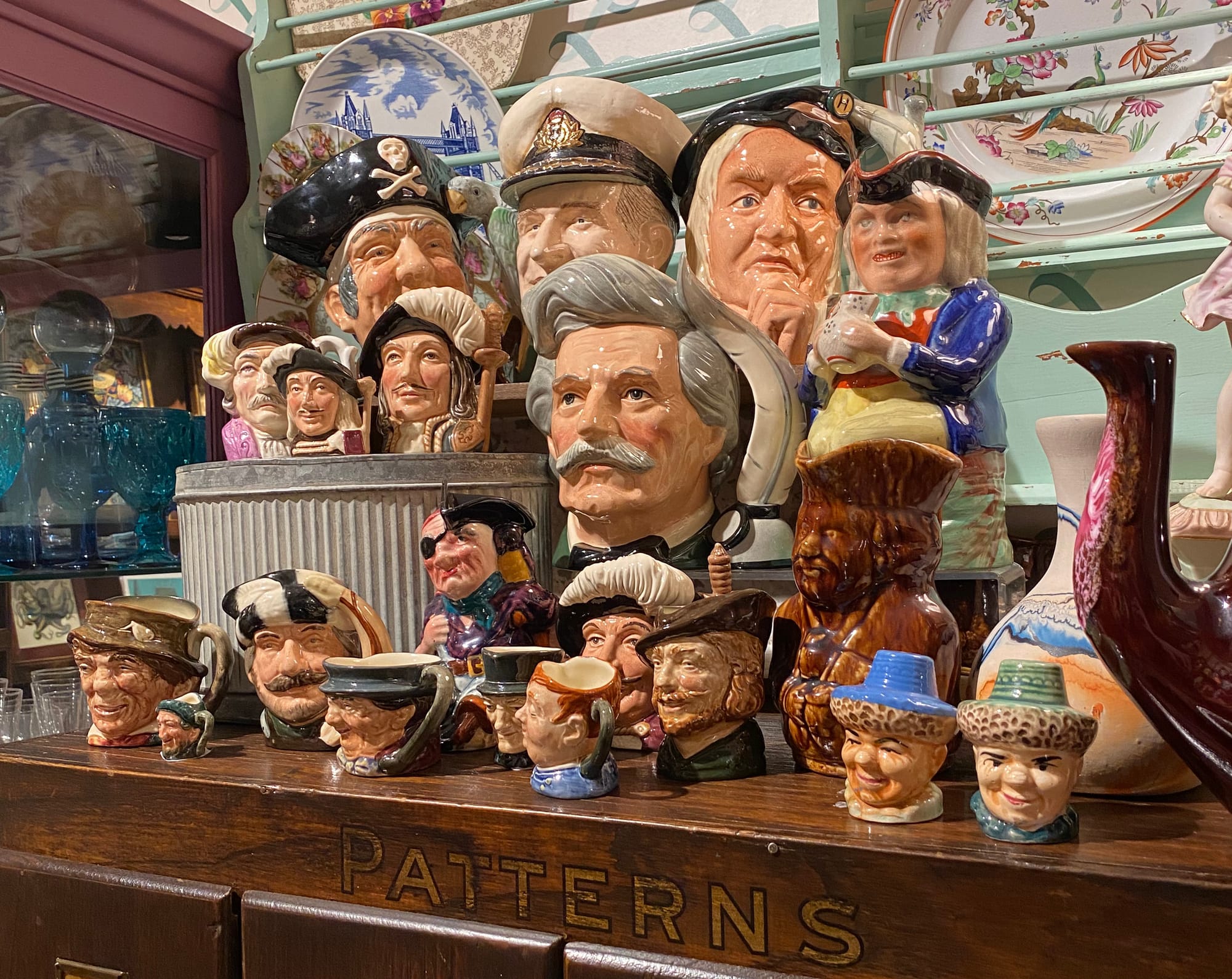 Collection of ceramic pieces in the shape of men's heads.