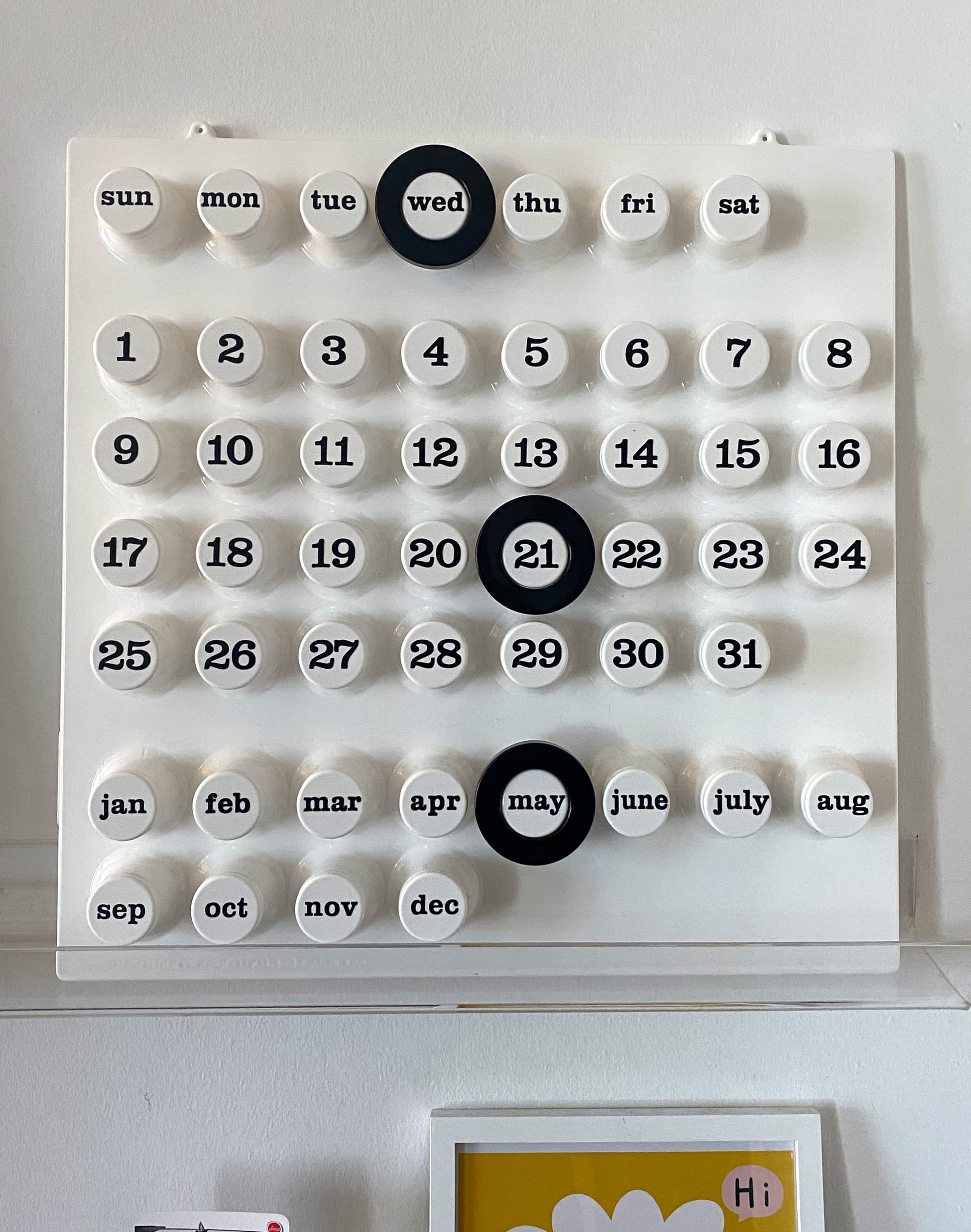 Close up of Ring-A-Date calendar showing rings set for Wednesday May 21.