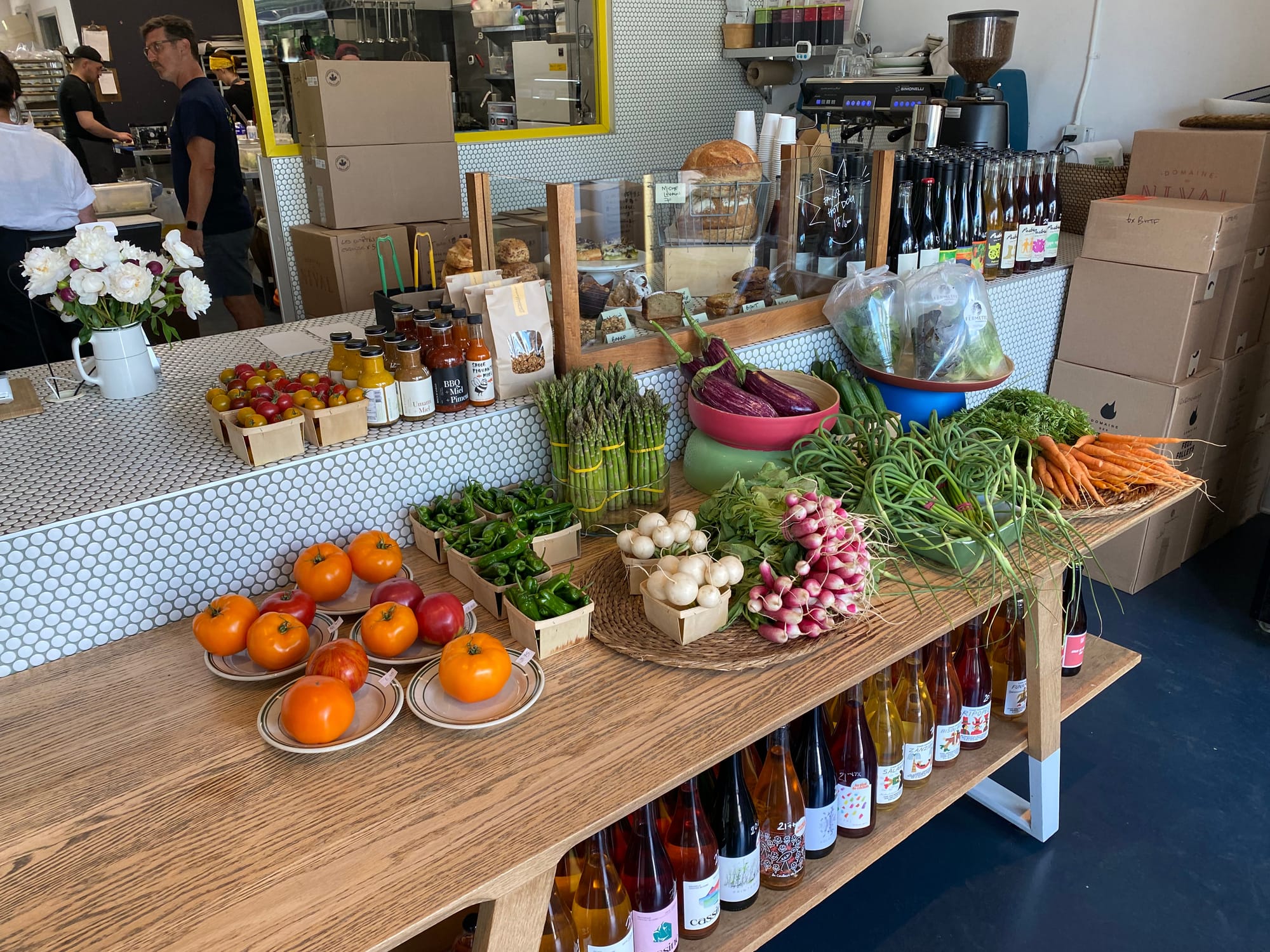 Fresh produce on a table inside the grocery store wing of Butterblume.