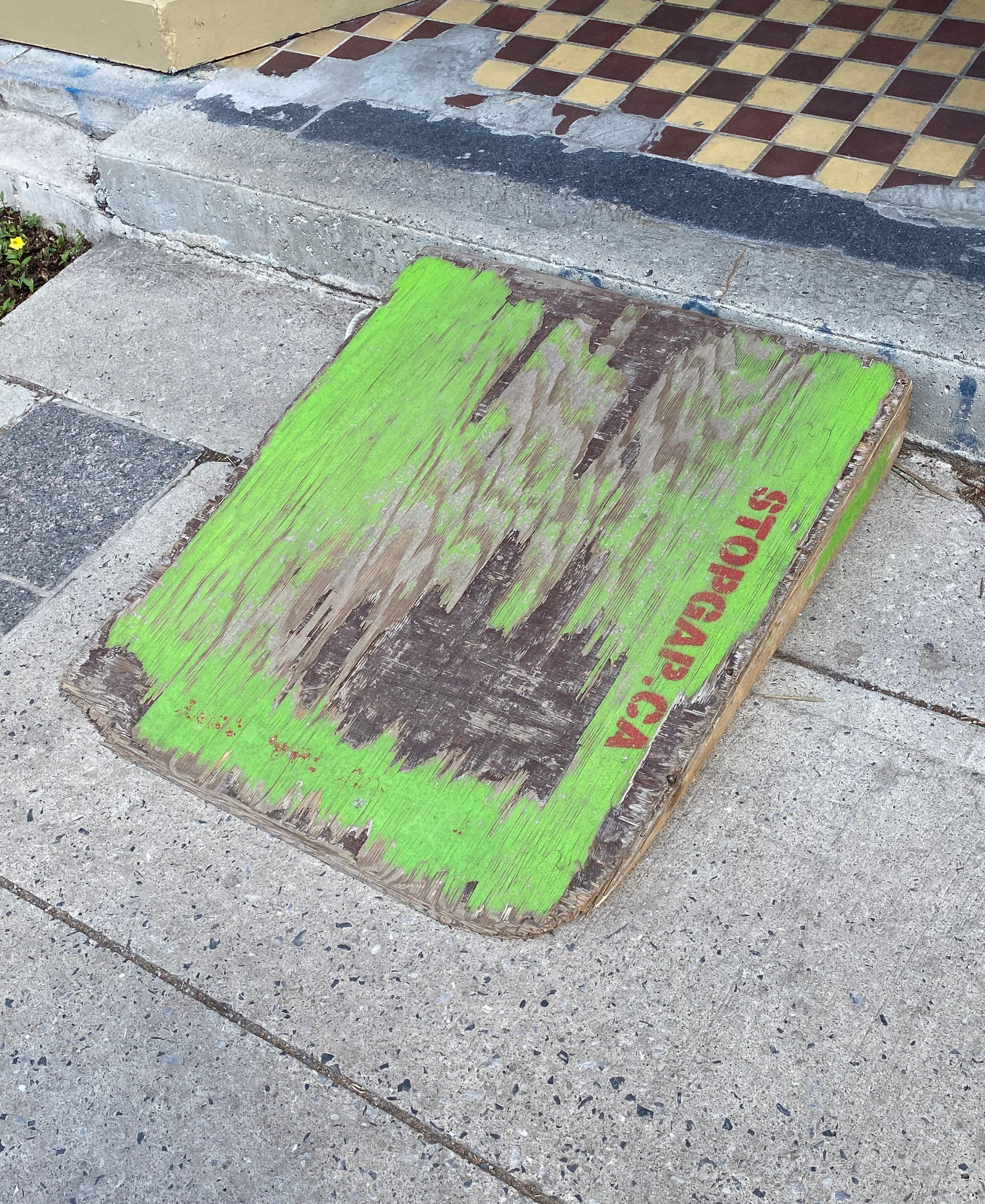 Weathered ramp with STOPGAP.CA stencilled on it.