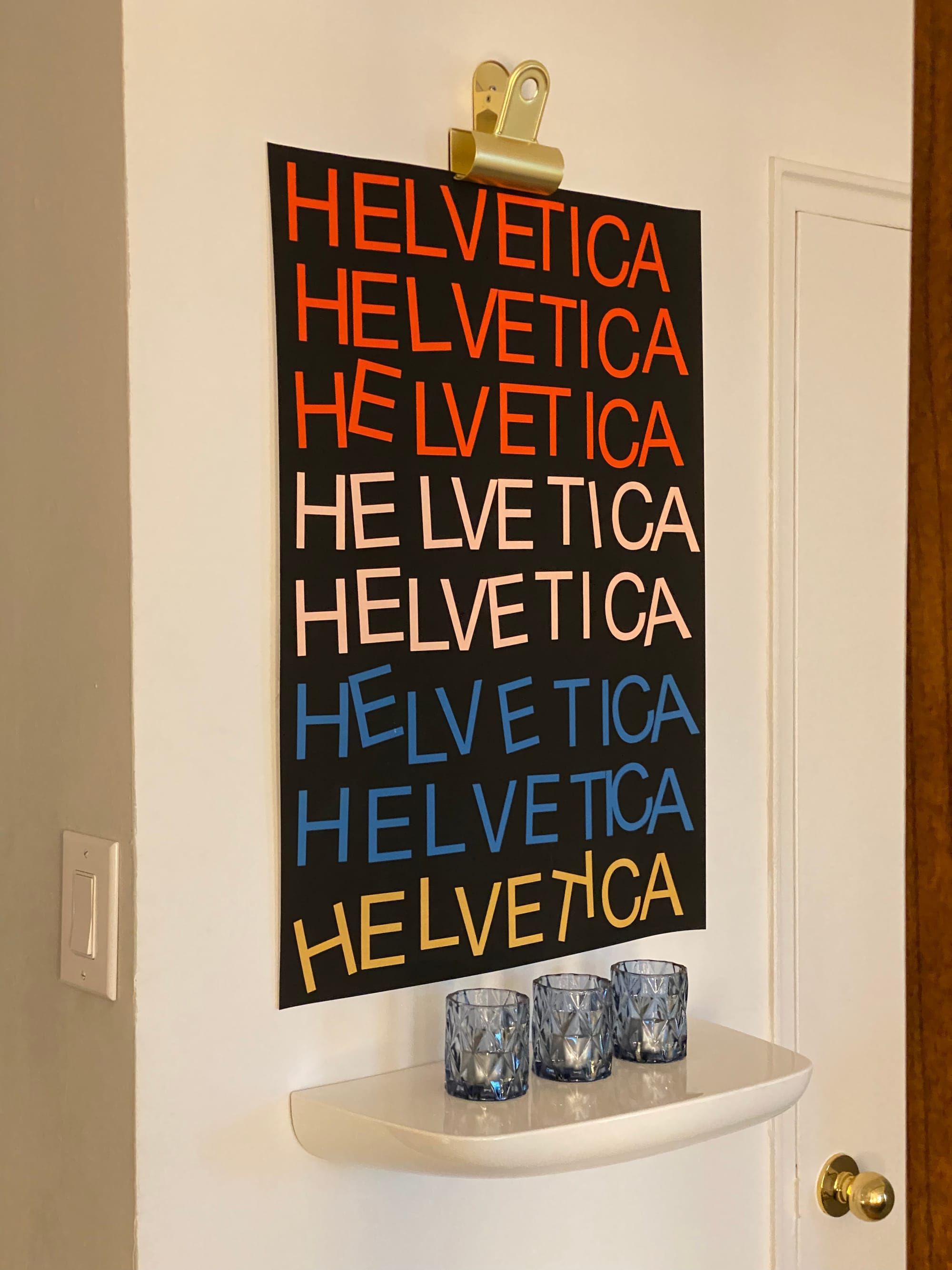 Poster with the word HELVETICA repeated, the letters irregularly placed.