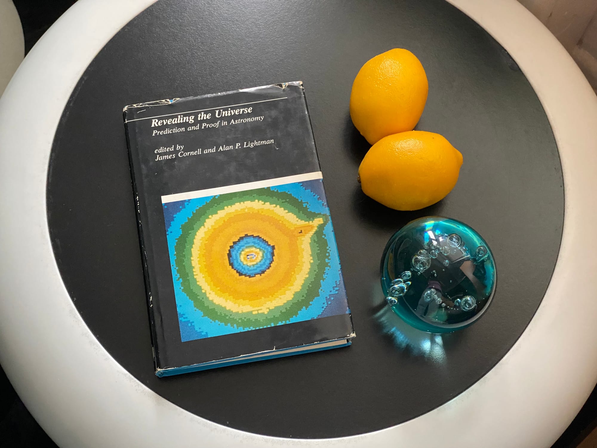 Arrangement on a side table, including two faux lemons.