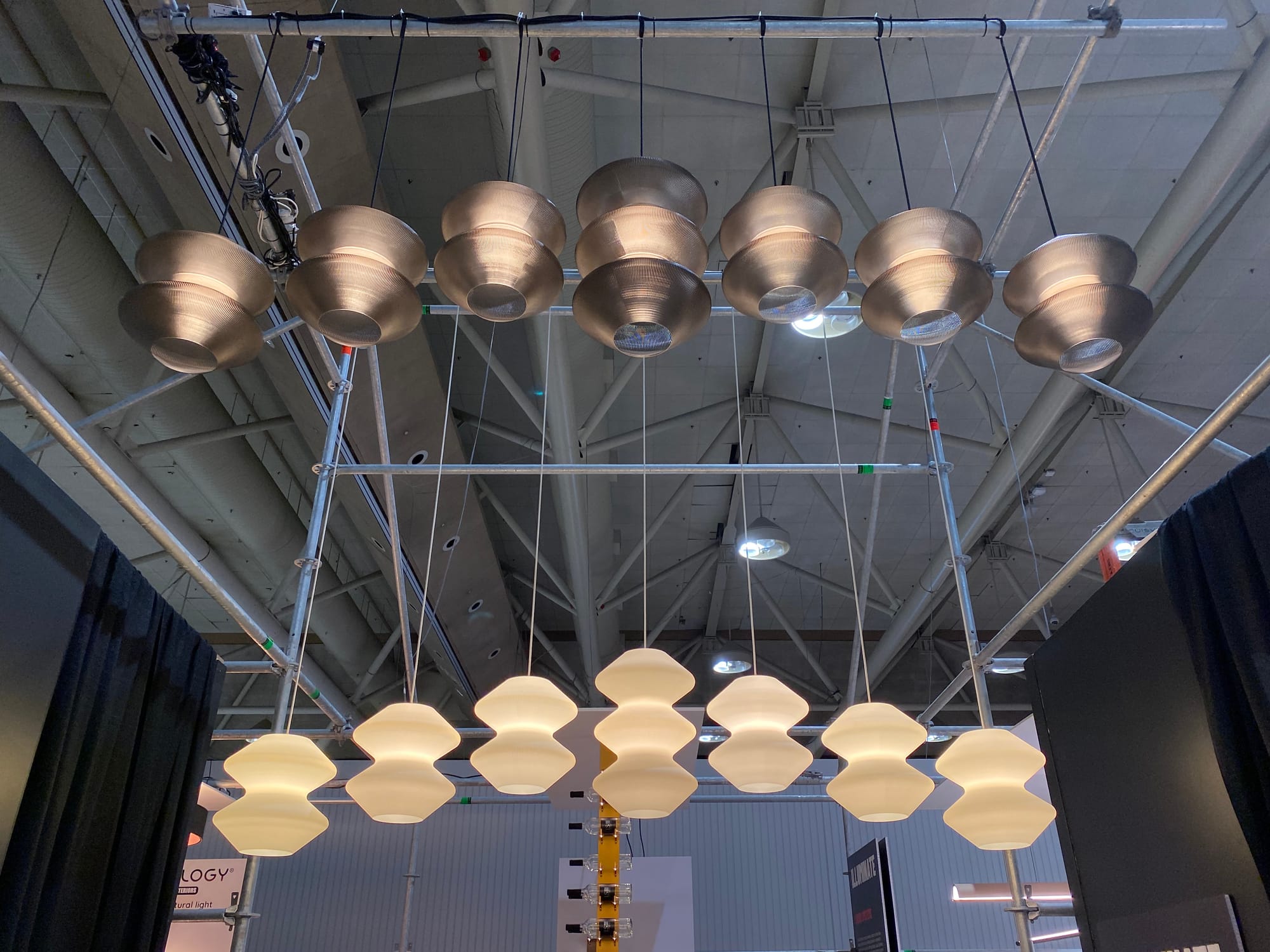 Two rows of lamps suspended very high.