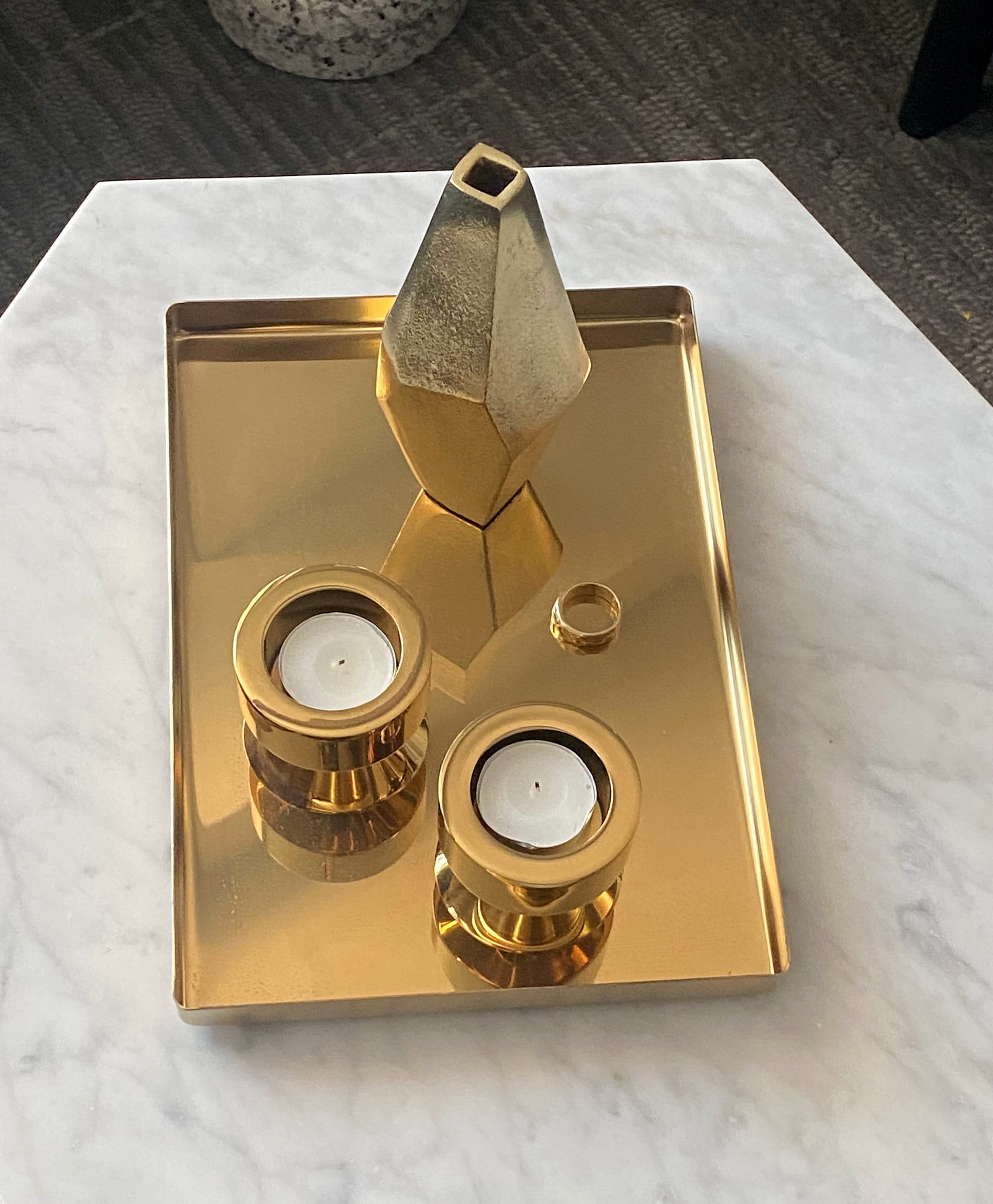 Brassy objects on brassy tray.