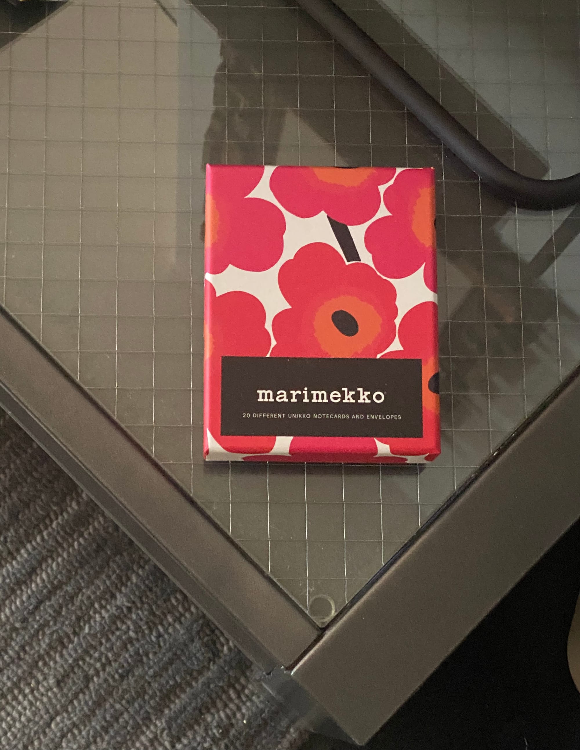 Box of Marimekko notecards with a graphic pattern of red poppies on the lid.