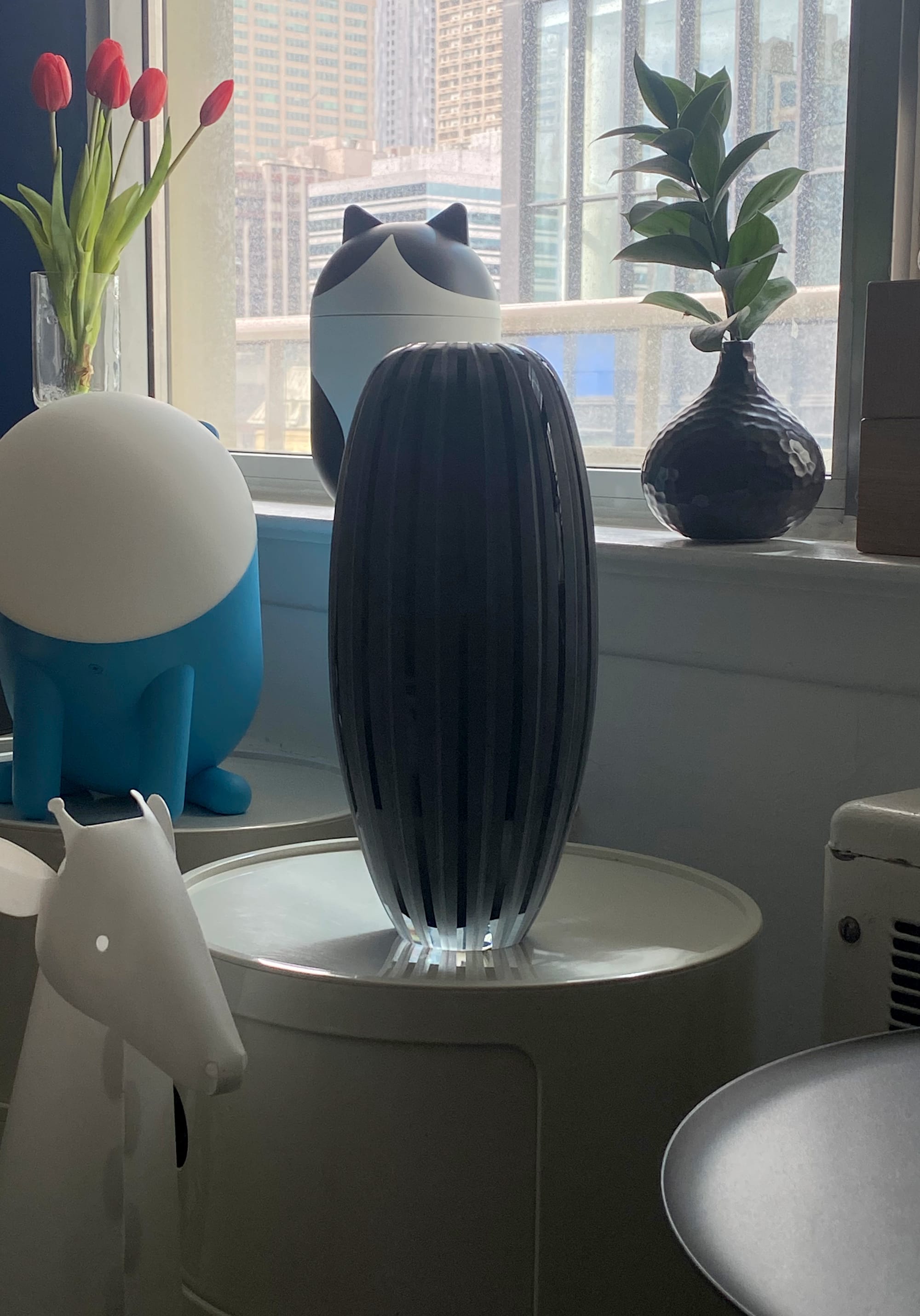 Black vase made of etched glass.