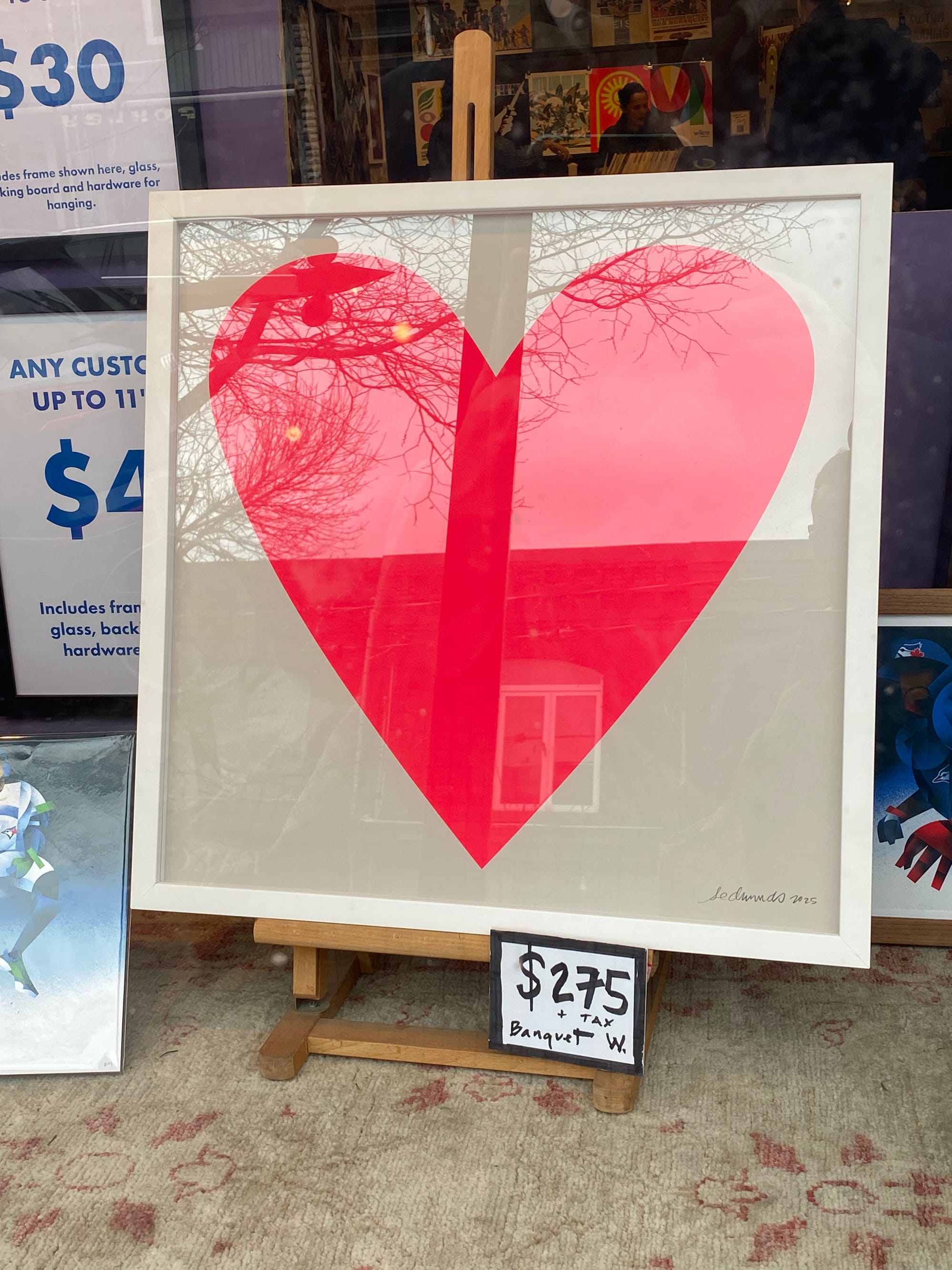 Framed print of a neon pink heart.