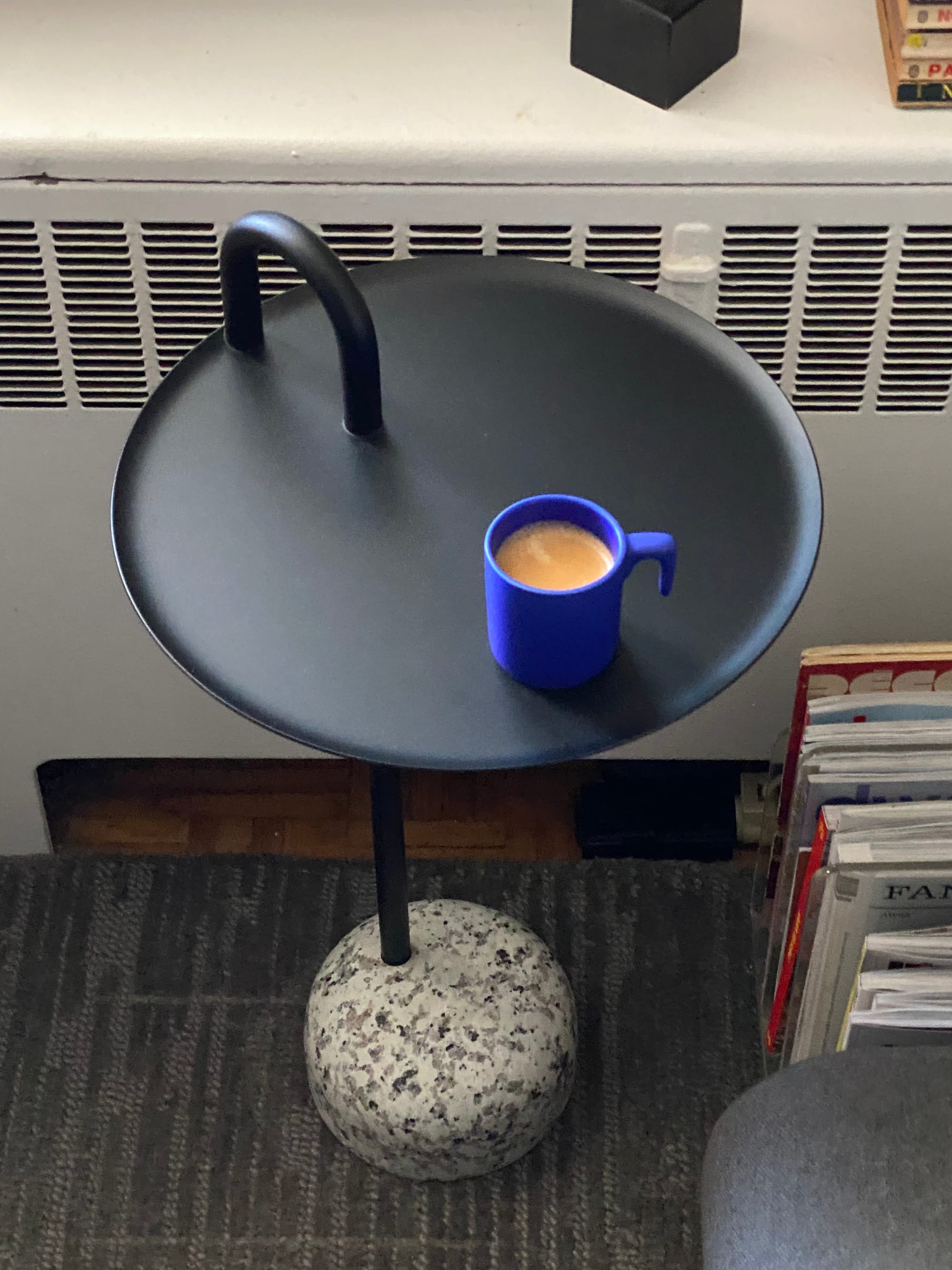 My Bowler side table with a cup of espresso resting on it.
