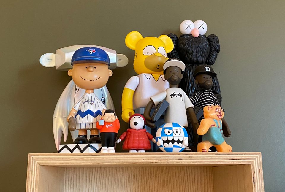 Display of figurines, including Charlie Brown and Snoopy.