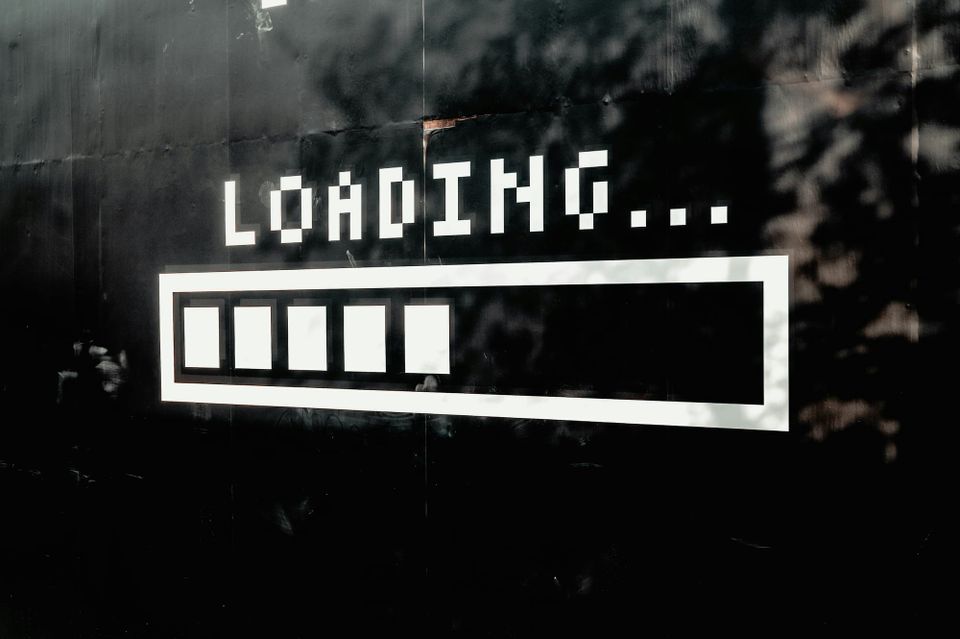 Street art featuring the word "LOADING..." and a progress bar underneath.
