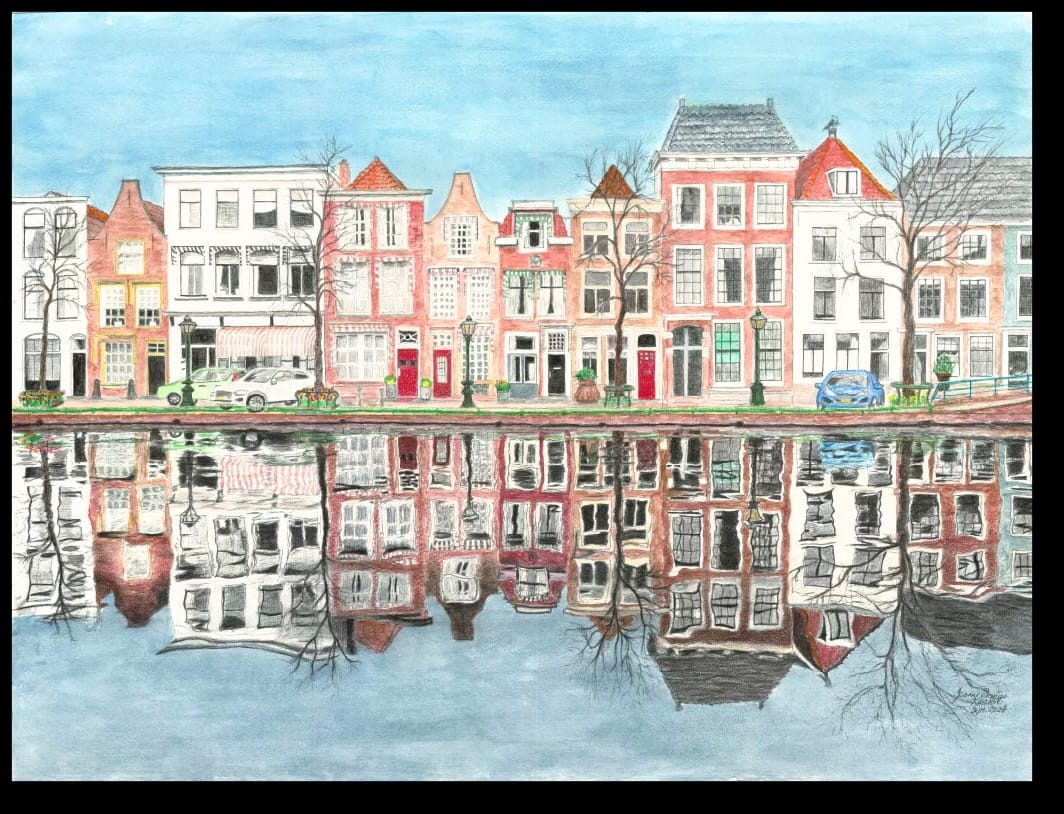 A row of colorful, historic European buildings reflects on a calm canal. Leafless trees and a clear blue sky enhance the serene, picturesque scene.