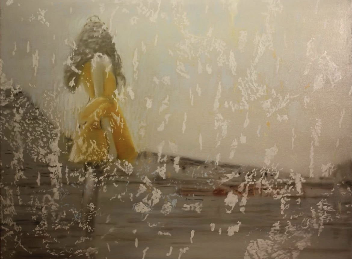 A child in a yellow dress stands alone on a textured surface with a blurred, grayish background, conveying melancholy and solitude.