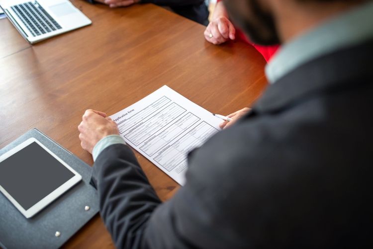Landlord reviewing tenant application paperwork