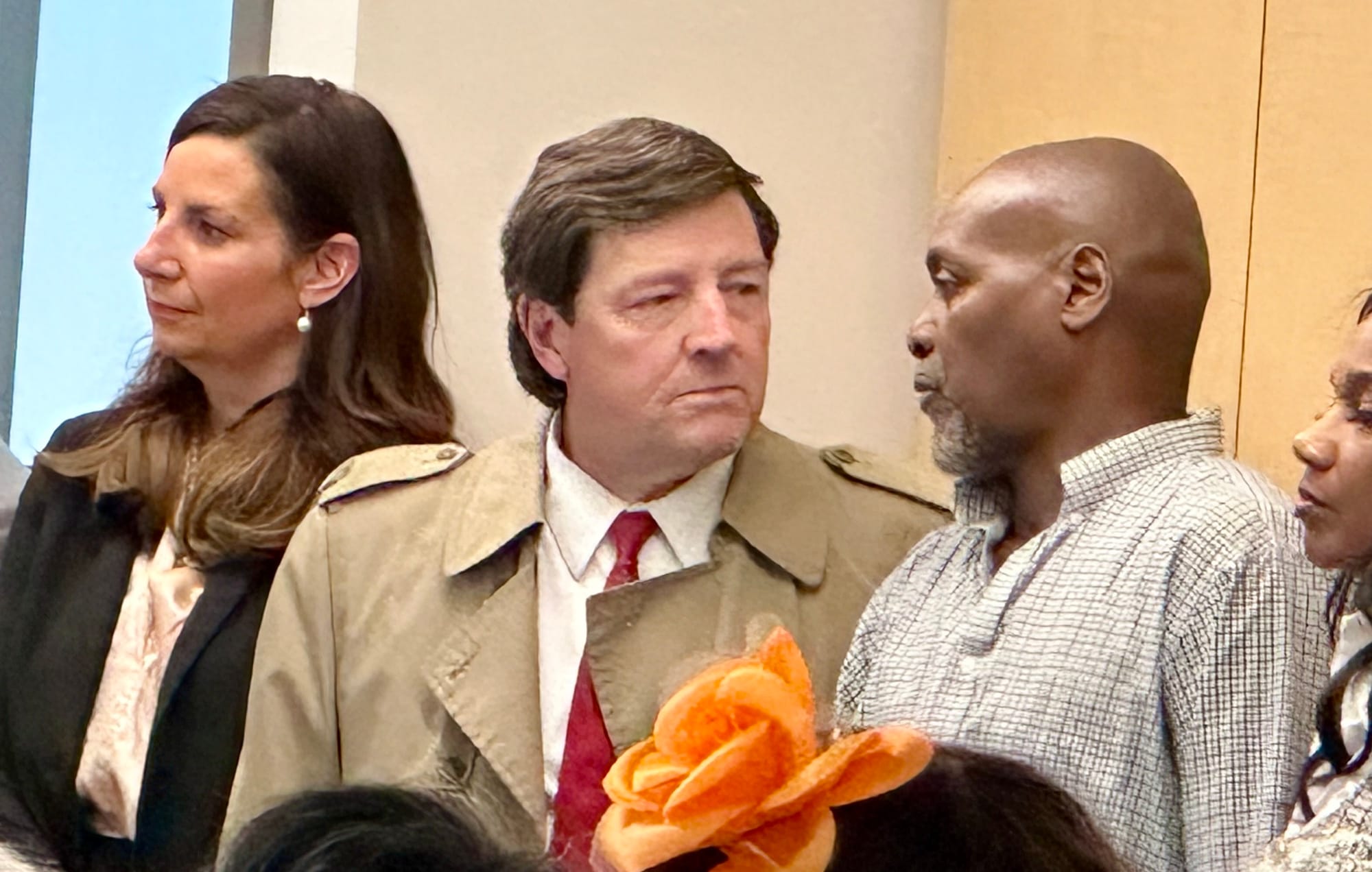 Ed Martin Ed Martin stands in a room speaking to a resident at a meeting with the Anacostia Coordinating Council.