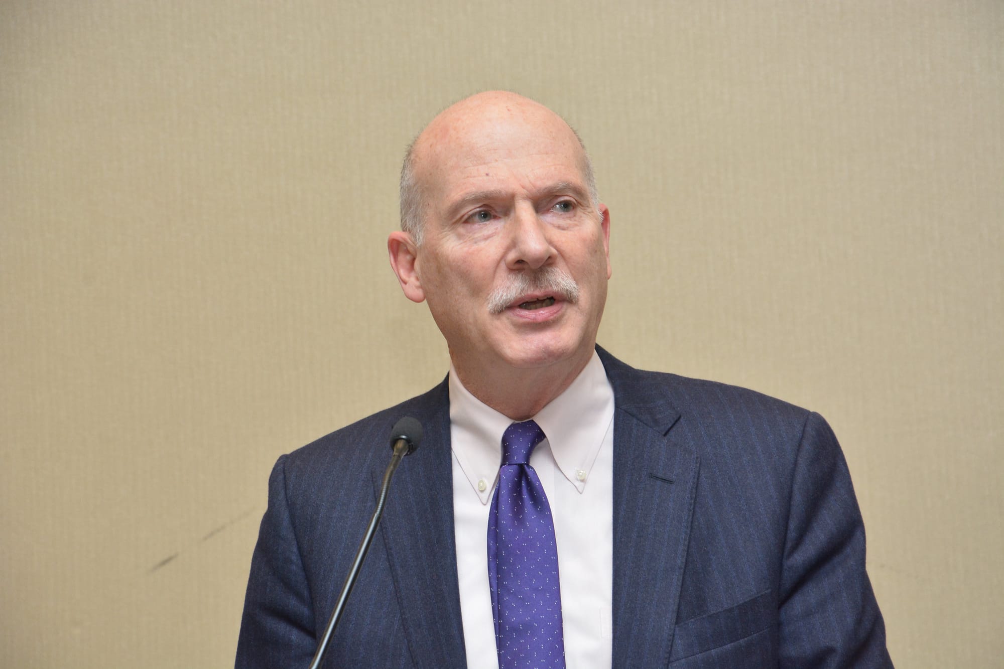 An image of Phil Mendelson speaking into a microphone