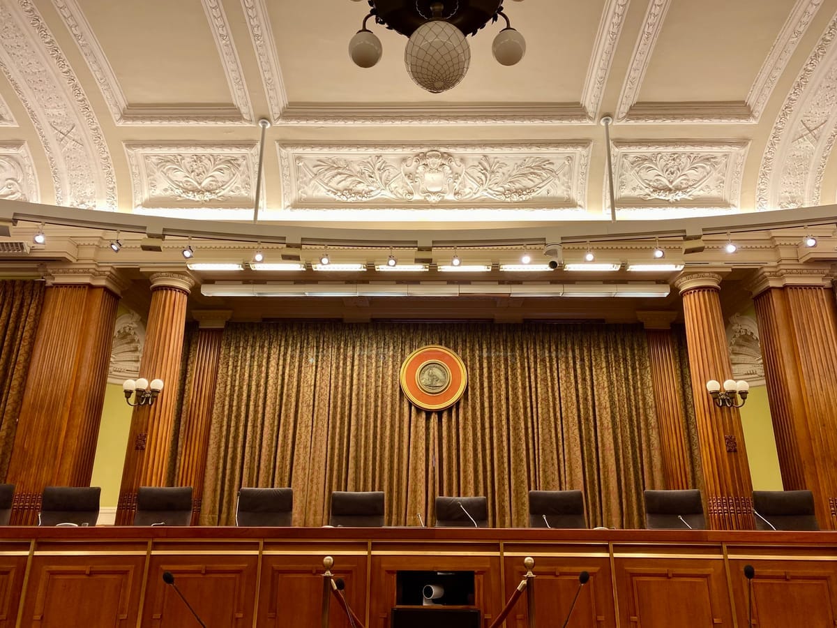 An image of the empty council dais in the Wilson Building. 