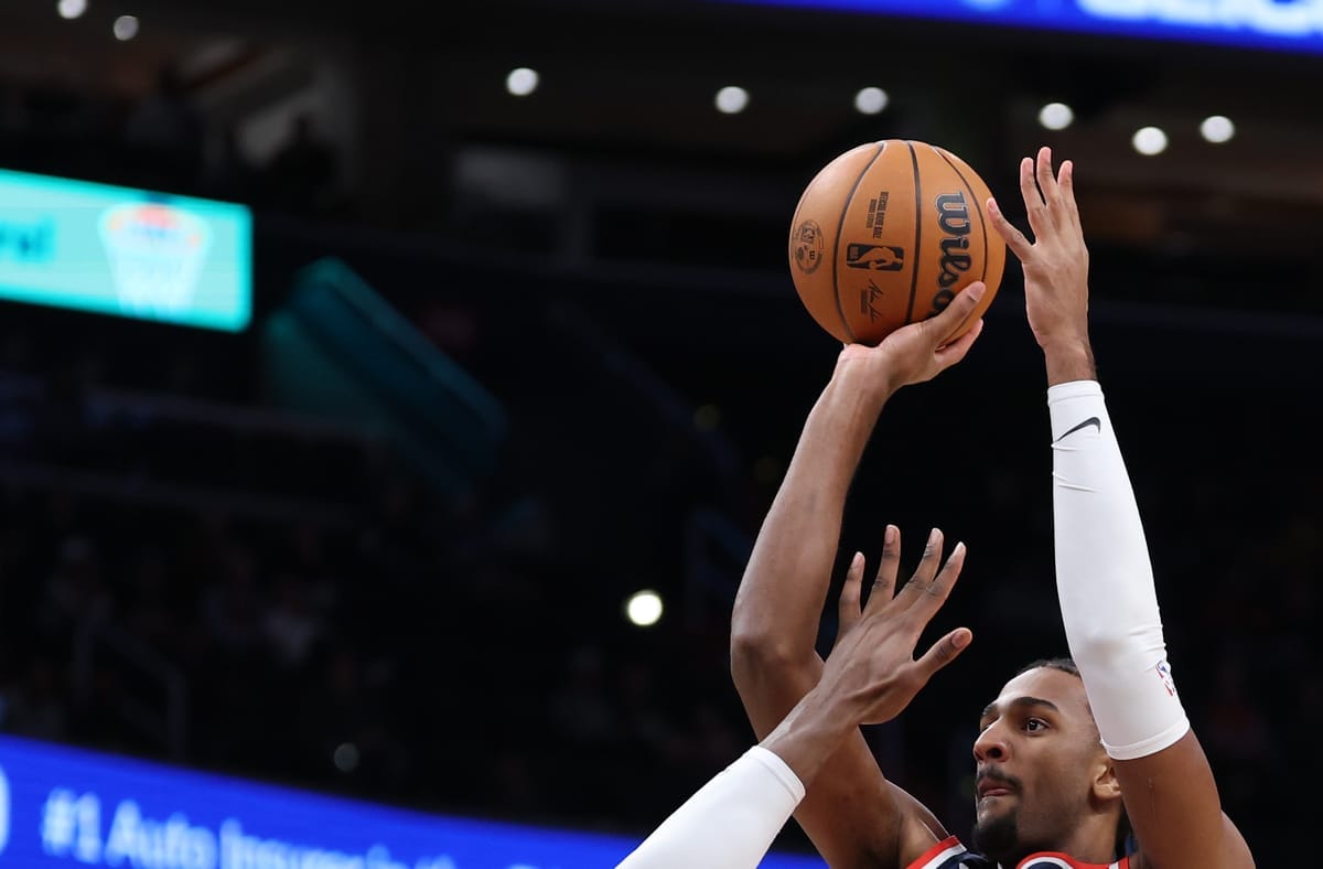 A Wizards player goes up to shoot. 