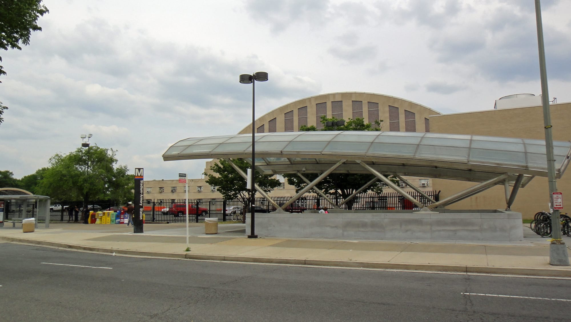 A metro station canopy in front of Stadium Armory.