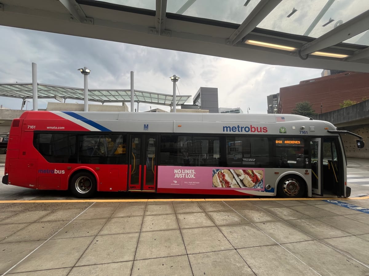 A Metrobus pared at a station. 