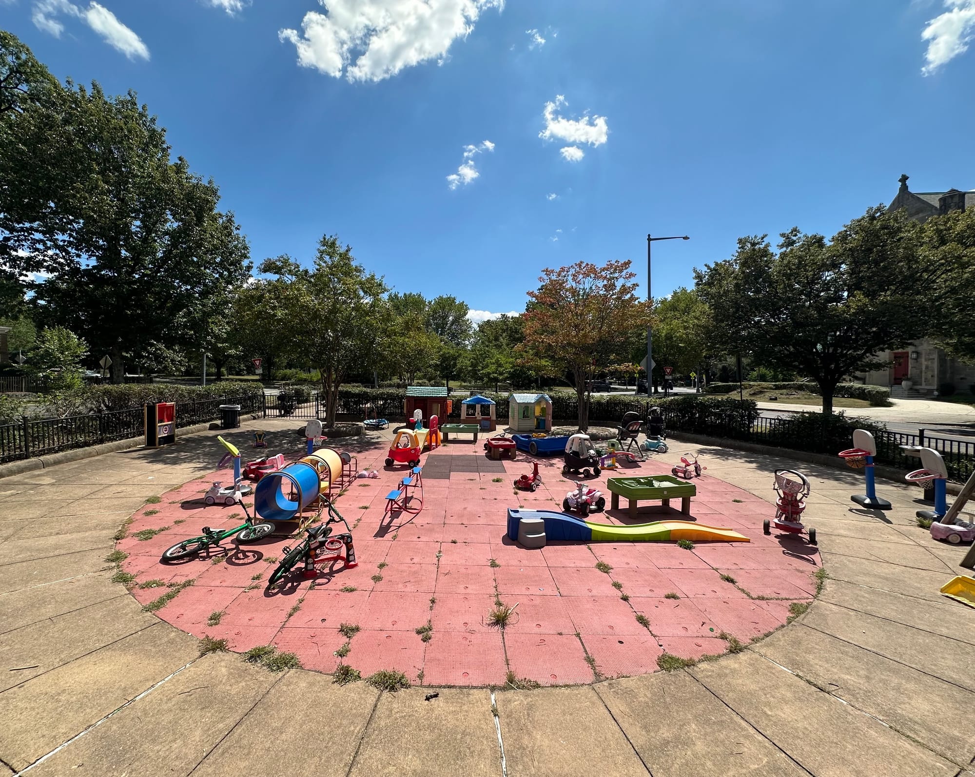A cement circle in Petworth that used to have a playground is now filled with random children's toys.