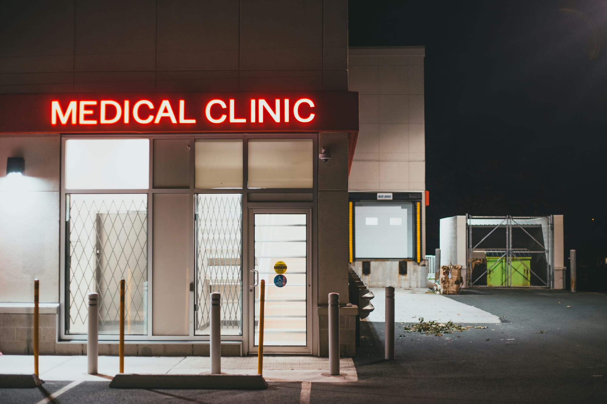The outside of a closed Medical Clinic and its parking lot.